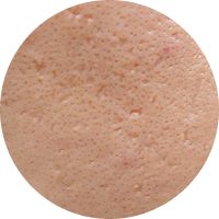 A close-up view of smooth skin texture showcasing pores and a natural appearance.