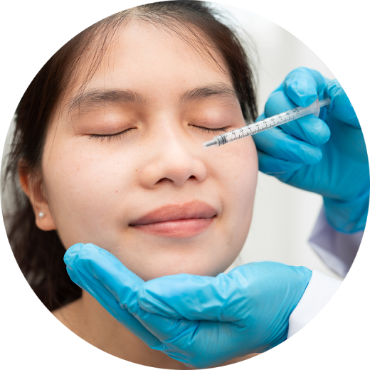A close-up view of a person receiving anti-wrinkle injections with a syringe in a clinical setting.
