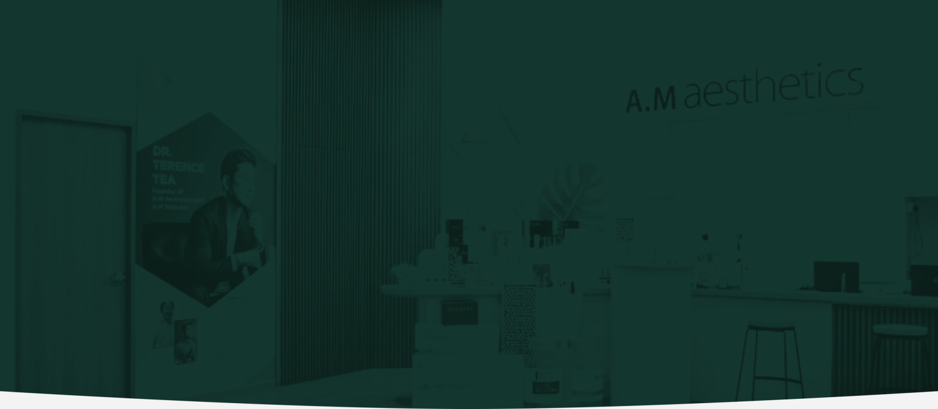 The interior of the AM Aesthetic clinic, featuring products on display and a promotional banner for Dr. Terence Tea.