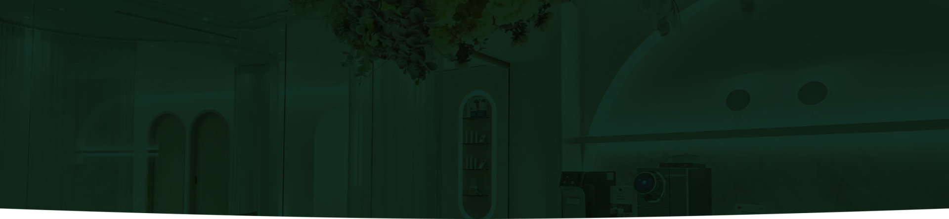 The interior of a modern aesthetic clinic featuring soft lighting and elegant decor.